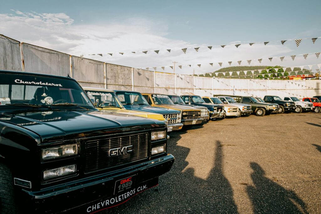 Row of classic pickup trucks parked outdoors
