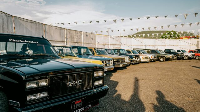 Row of classic pickup trucks parked outdoors